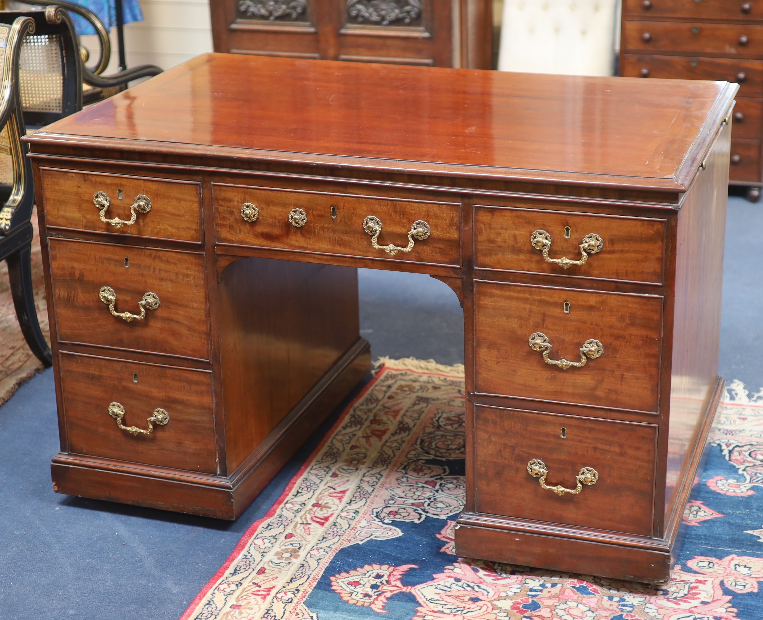 A George IV mahogany kneehole desk by William Williamson & Son of Guildford, second quarter 19th century width 125cm depth 79cm height